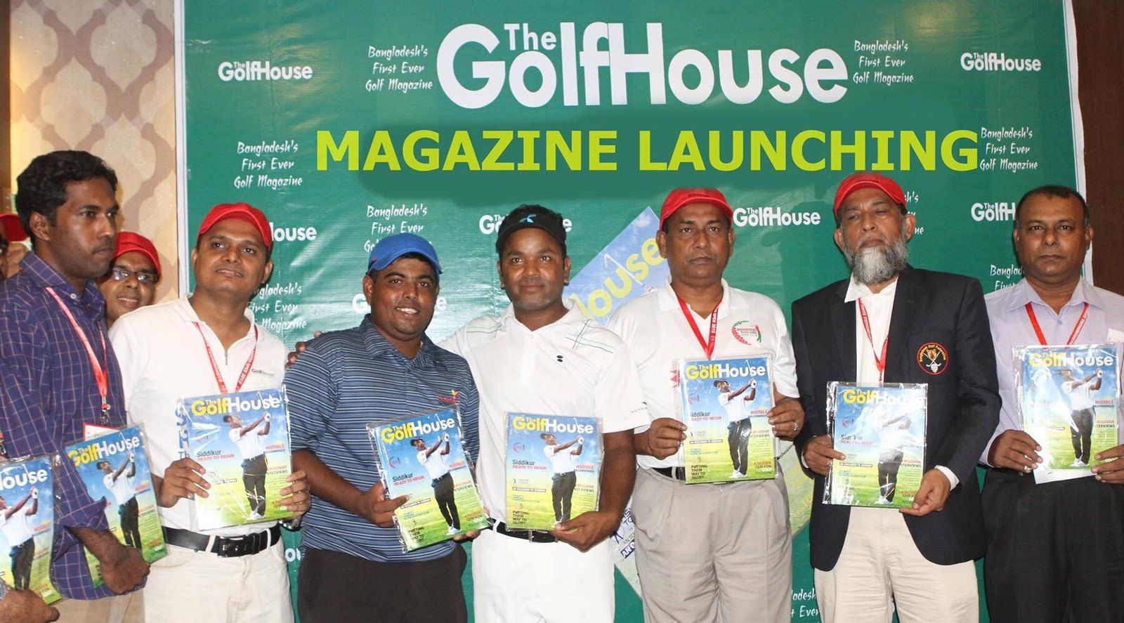 Guests holding early issues at TheGolfHouse magazine launch